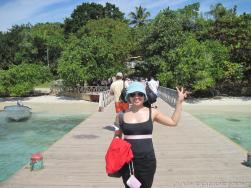 Joann stands on the dock of Cayo Levantado.jpg