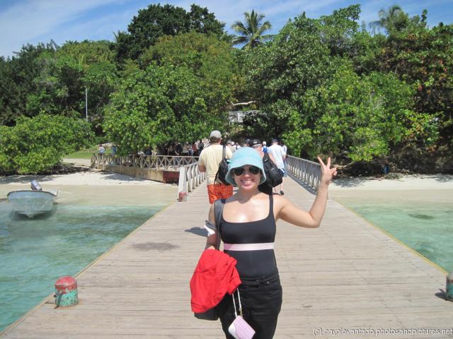 Joann stands on the dock of Cayo Levantado.jpg