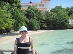 Joann with Gran Bahia Principe in Cayo Levantado in the background.jpg