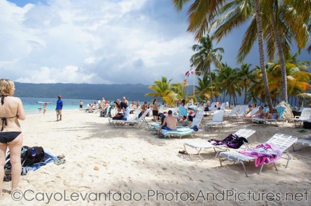 Vacationers at Cayo Levantado beach.jpg