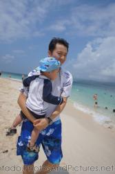 Darwin being carried by Daddy at Cayo Levantado.jpg