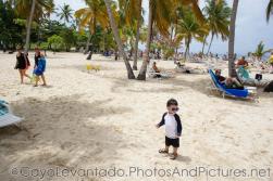Darwin in sunglasses looks around at Cayo Levantado beach.jpg