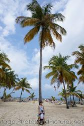 Darwin and mommy in front of a tall palm tree at Cayo Levantado.jpg