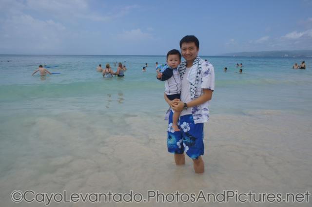 Darwin and daddy at Cayo Levantado beach waters.jpg