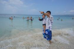 Darwin and daddy point at the same direction at Cayo Levantado beach.jpg